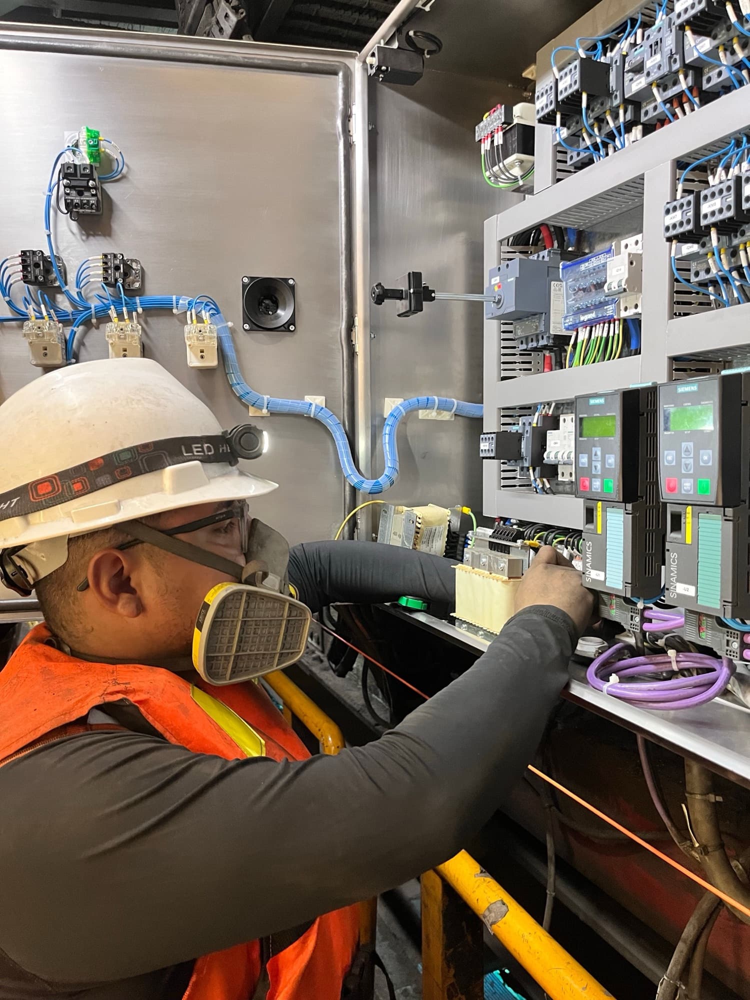 Engineer working on a variable-speed drives panel